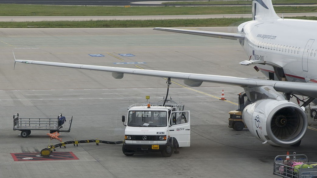 truck refuelling a plane