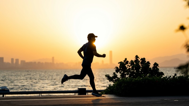 man running during sunrise